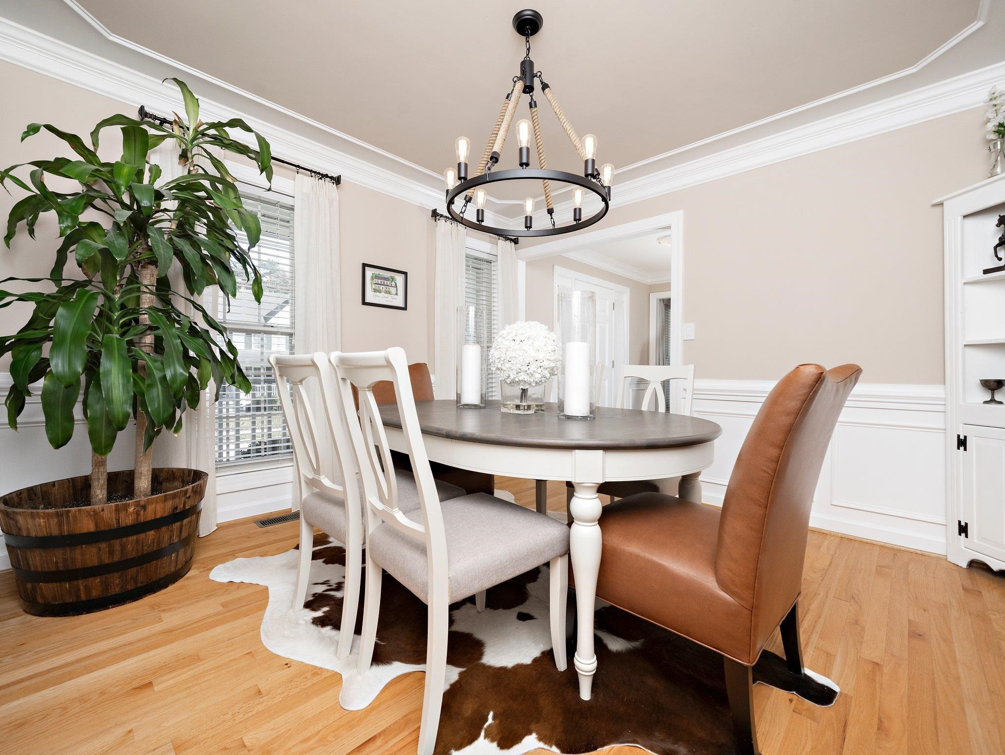 8312 Hobhouse Circle Raleigh, NC 27615 - Photo 14 of 39 a view of a dining room with furniture window and wooden floor