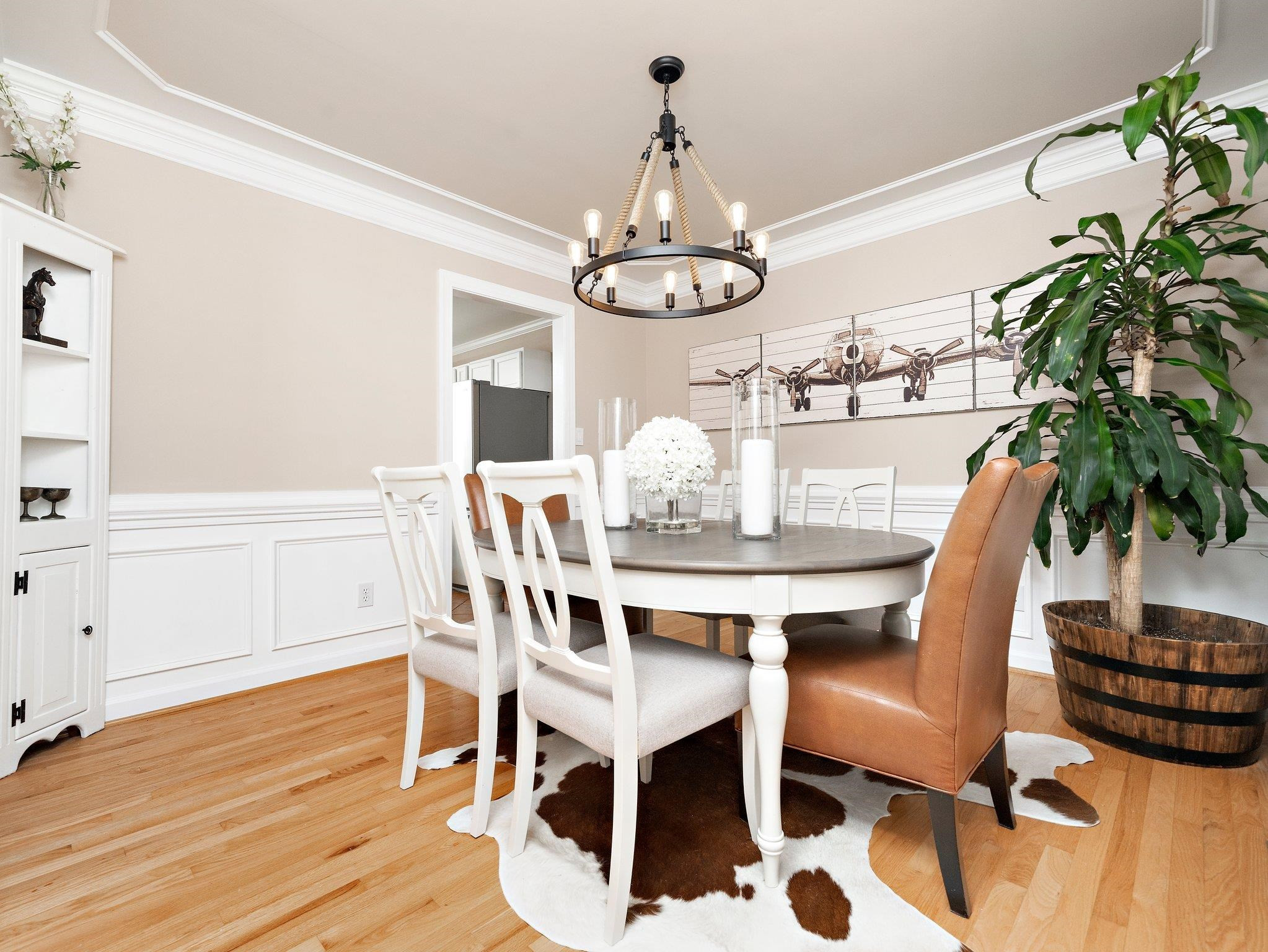 8312 Hobhouse Circle Raleigh, NC 27615 - Photo 15 of 39 a view of a dining room with furniture window and wooden floor