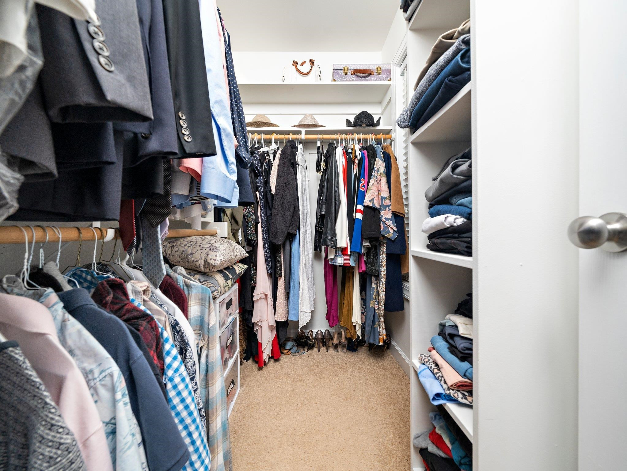8312 Hobhouse Circle Raleigh, NC 27615 - Photo 19 of 39 a view of walk in closet with clothes and shoes