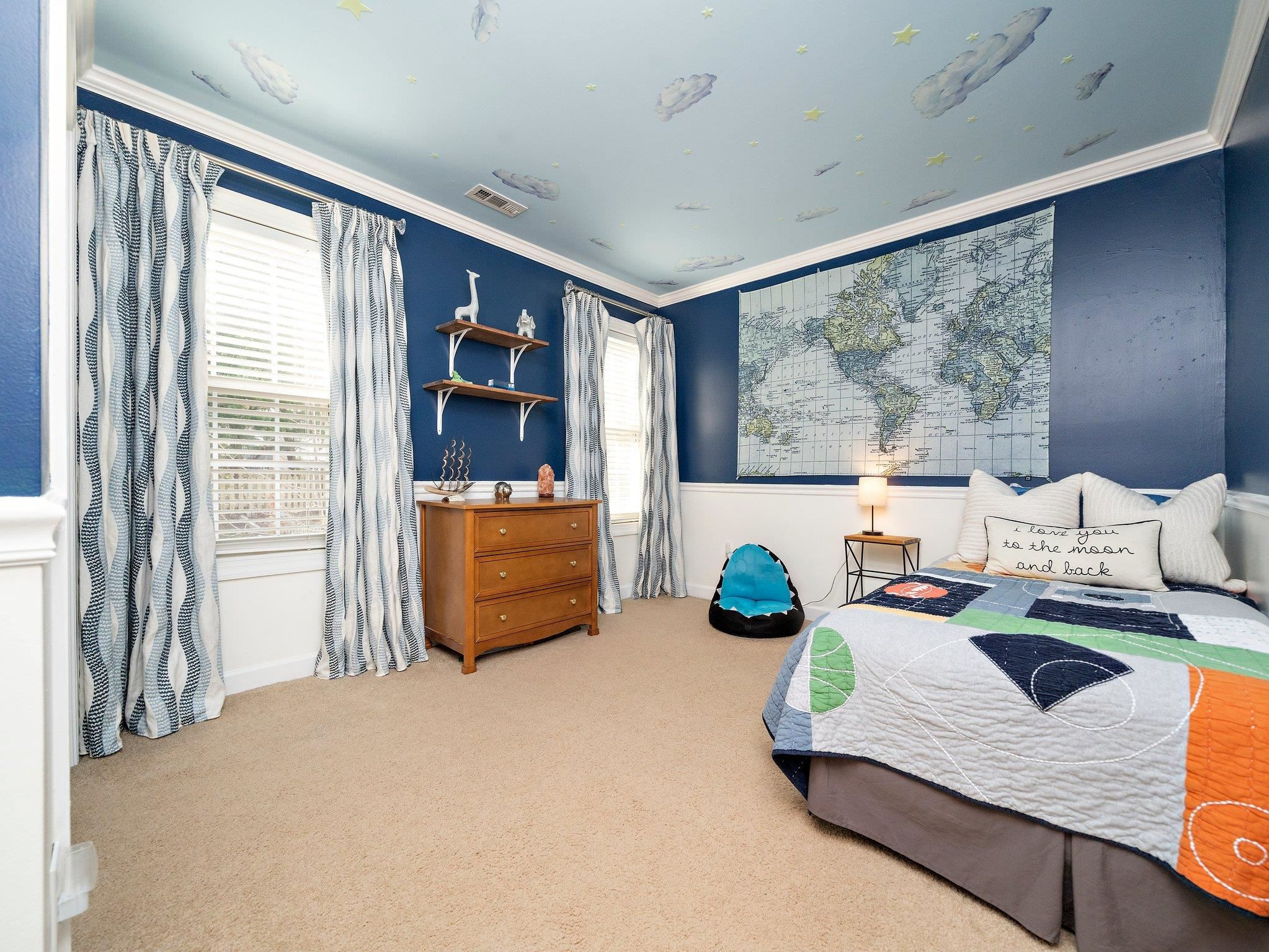 8312 Hobhouse Circle Raleigh, NC 27615 - Photo 23 of 39 a bedroom with furniture and a large window