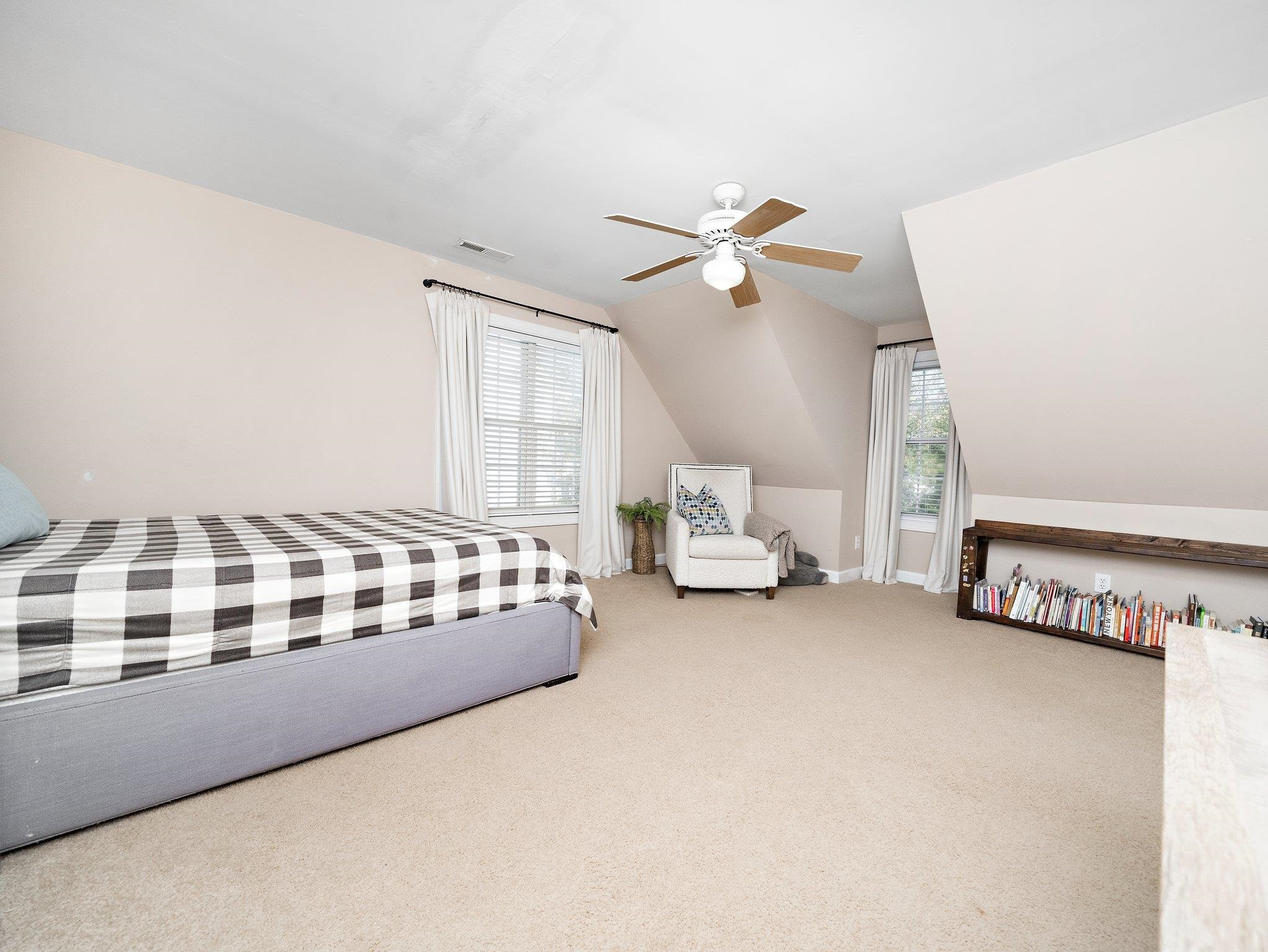 8312 Hobhouse Circle Raleigh, NC 27615 - Photo 25 of 39 a spacious bedroom with a bed and a large window