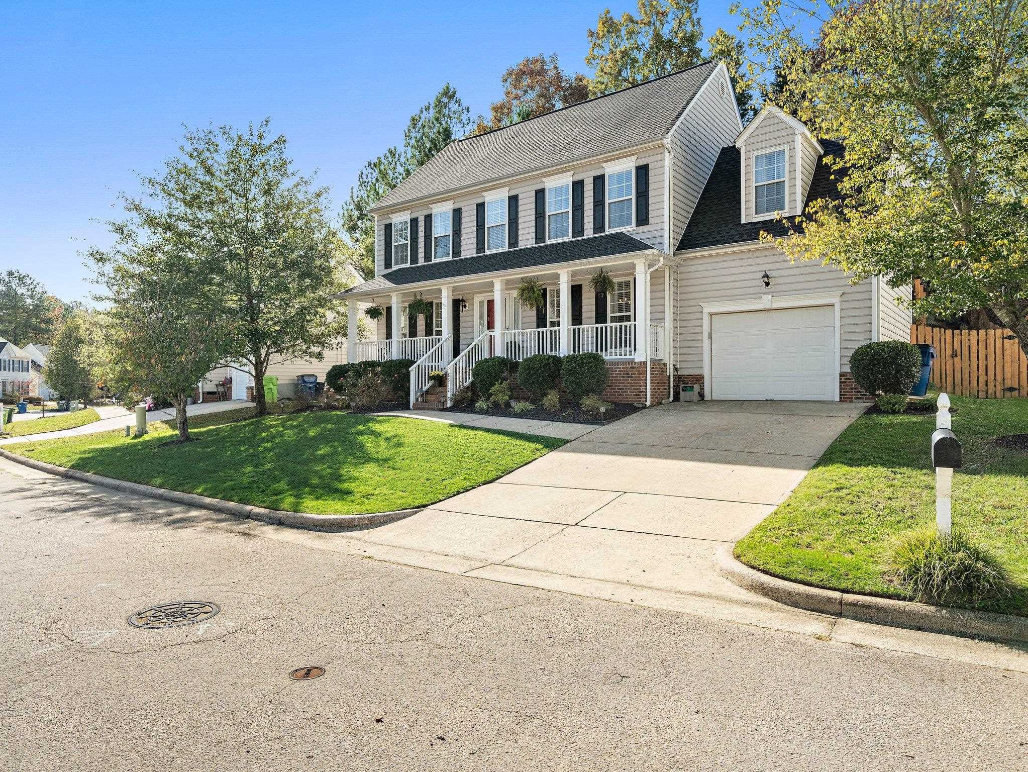 8312 Hobhouse Circle Raleigh, NC 27615 - Photo 30 of 39 a front view of a house with a garden and pathway