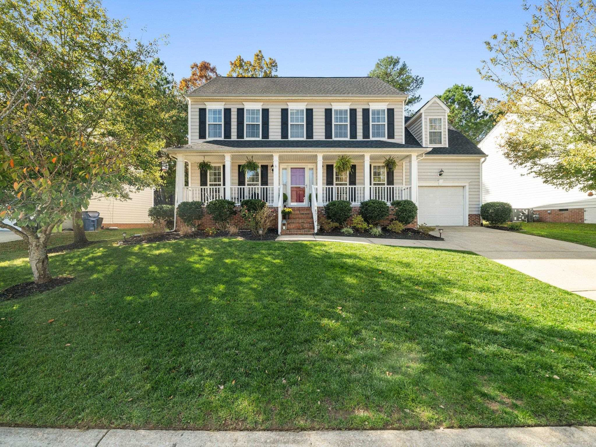 8312 Hobhouse Circle Raleigh, NC 27615 - Photo 31 of 39 a front view of a house with a yard