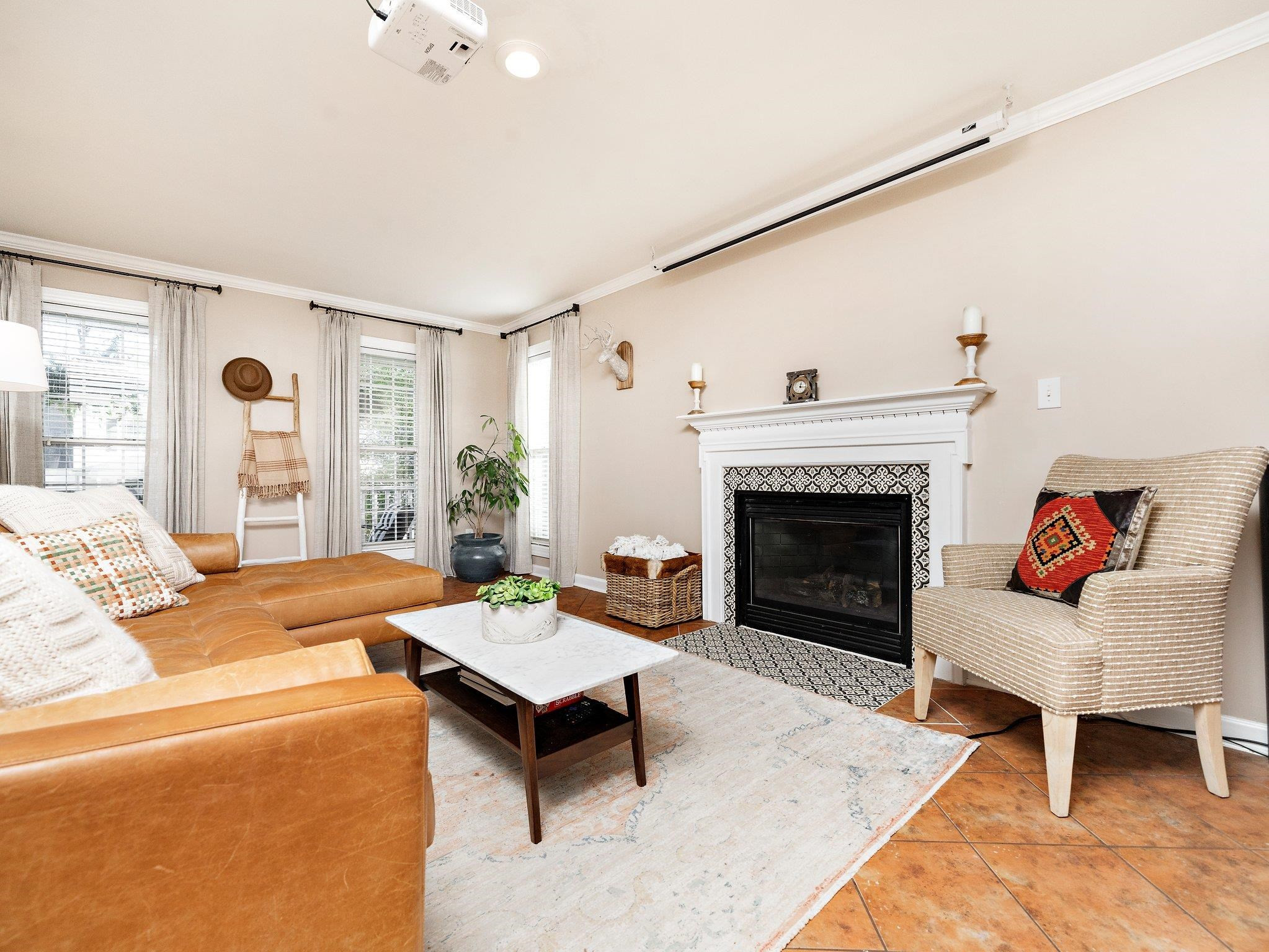 8312 Hobhouse Circle Raleigh, NC 27615 - Photo 6 of 39 a living room with furniture a rug and a fireplace