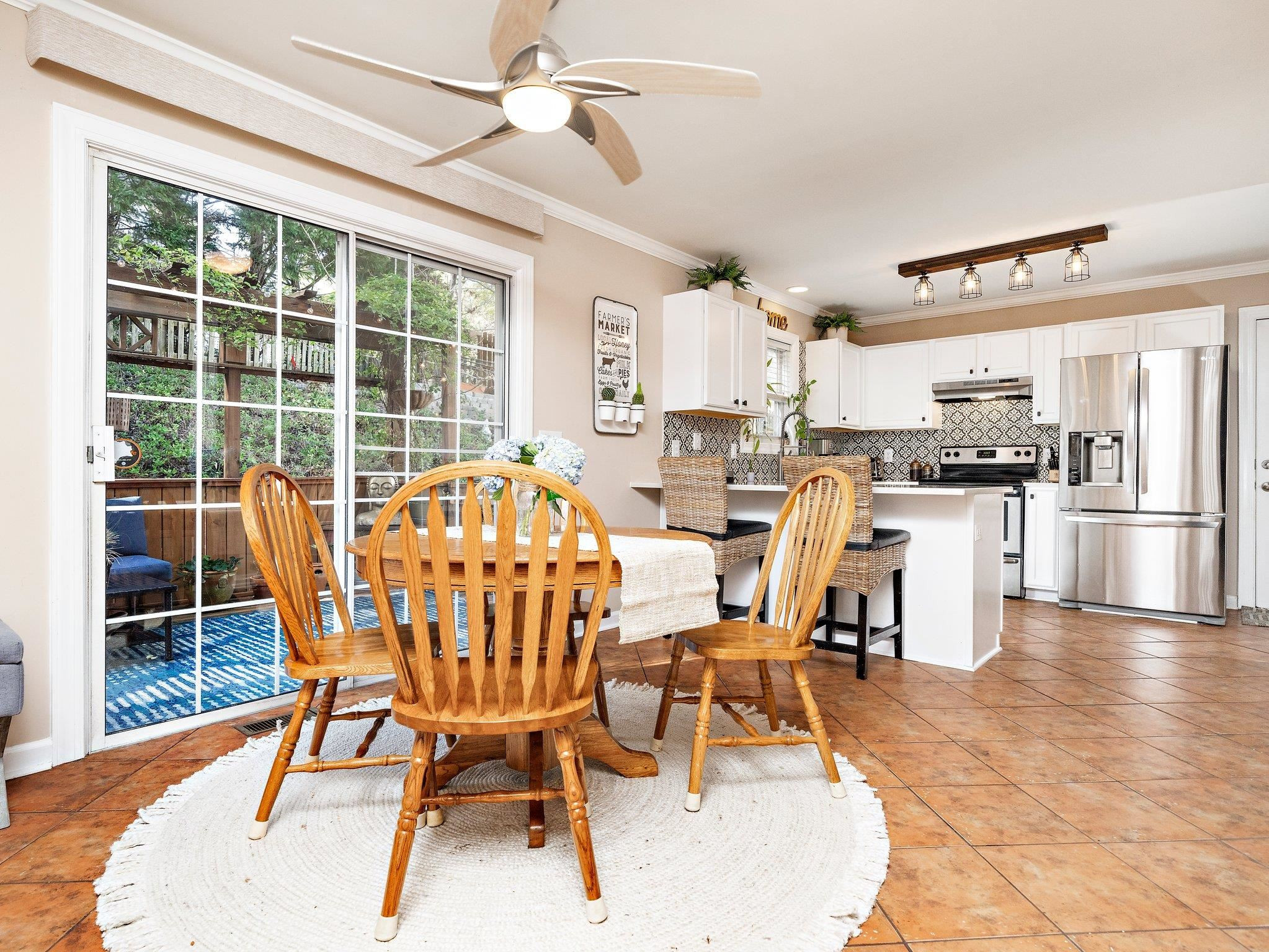 8312 Hobhouse Circle Raleigh, NC 27615 - Photo 8 of 39 a view of a dining room with furniture window and wooden floor