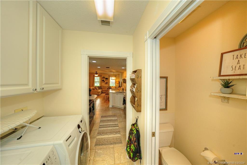 3073 East Community Drive Jupiter, FL 33458 - Photo 18 of 85 a bathroom with a sink and a shower