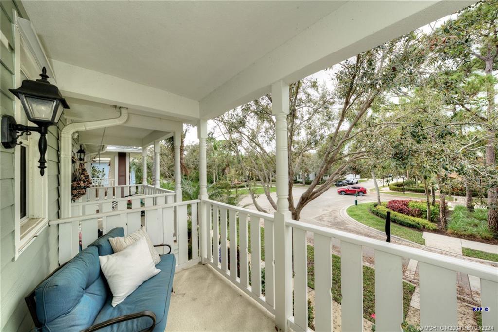 3073 East Community Drive Jupiter, FL 33458 - Photo 32 of 85 a view of a porch with furniture