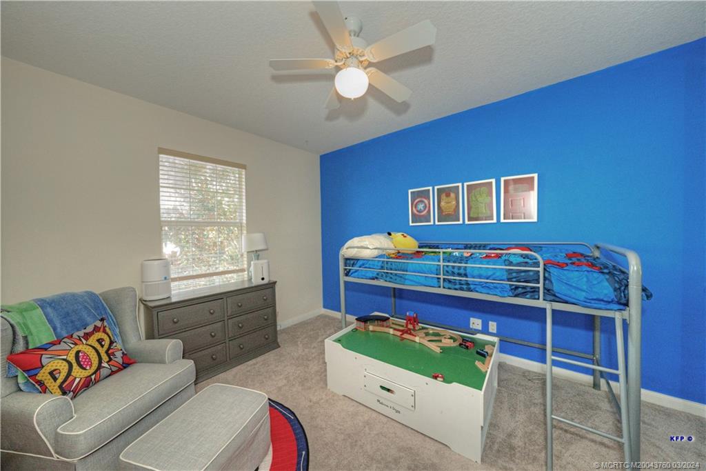 3073 East Community Drive Jupiter, FL 33458 - Photo 34 of 85 a living room with furniture and a window