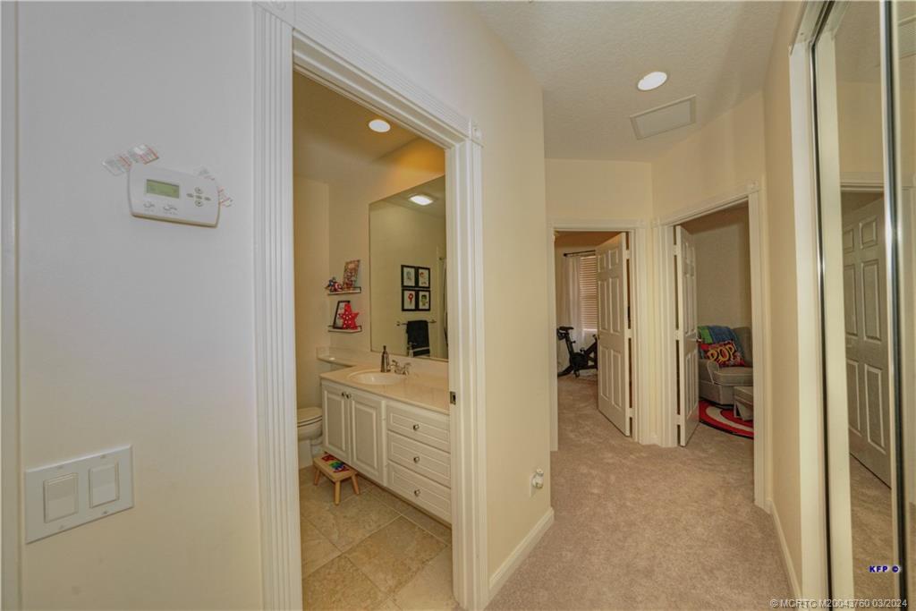 3073 East Community Drive Jupiter, FL 33458 - Photo 38 of 85 a view of a hallway with closet and a livingroom view