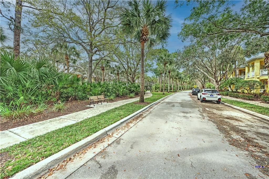 3073 East Community Drive Jupiter, FL 33458 - Photo 49 of 85 a park view with a bench