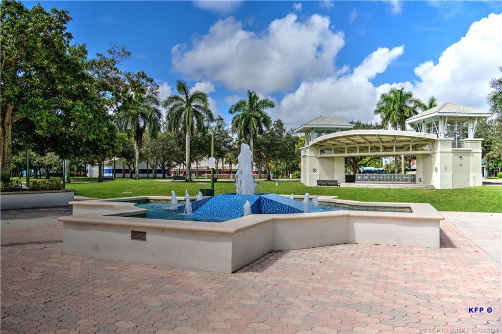 3073 East Community Drive Jupiter, FL 33458 - Photo 63 of 85 a view of pool with outdoor seating and yard