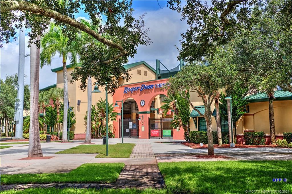 3073 East Community Drive Jupiter, FL 33458 - Photo 69 of 85 a view of a building with street and trees
