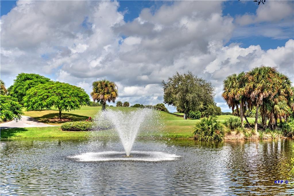 3073 East Community Drive Jupiter, FL 33458 - Photo 74 of 85 a view of a water fountain in a yard