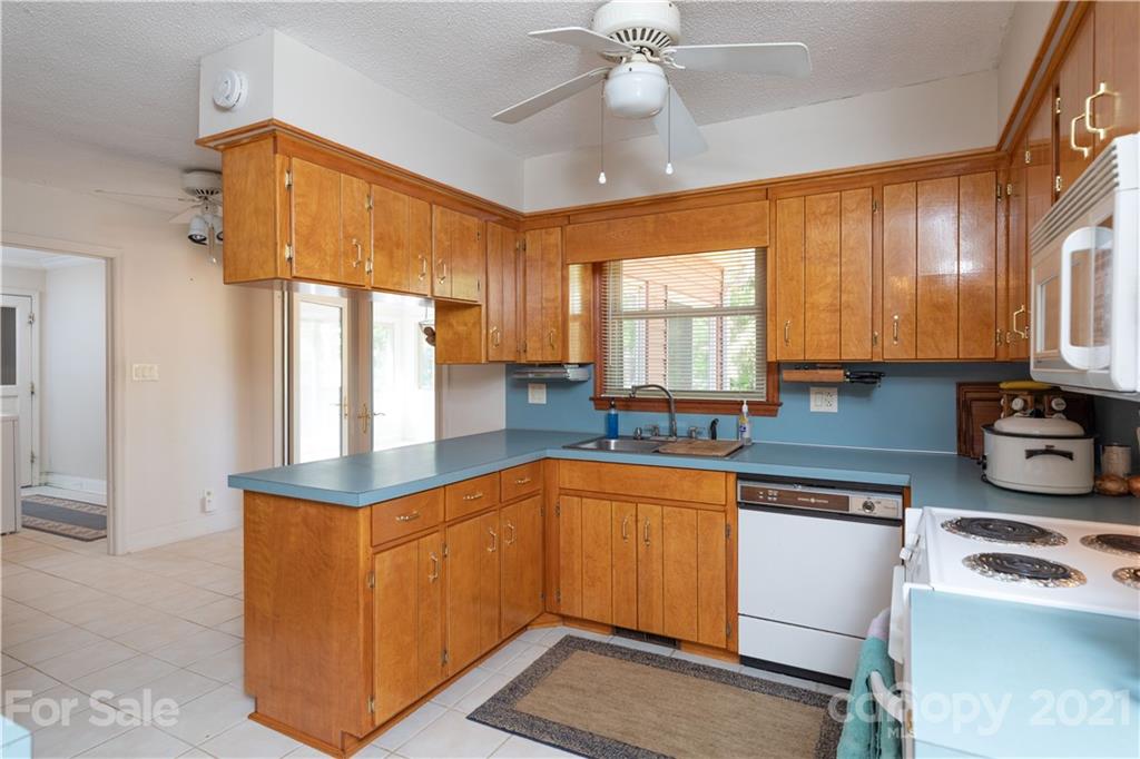 11 Friendfield Court Fort Mill, SC 29715 - Photo 7 of 32 a kitchen with stainless steel appliances granite countertop a sink a stove cabinets counter space and a window