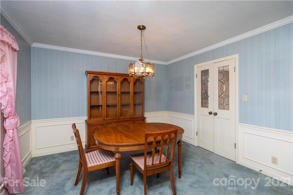 11 Friendfield Court Fort Mill, SC 29715 - Photo 9 of 32 a dining room with furniture and chandelier