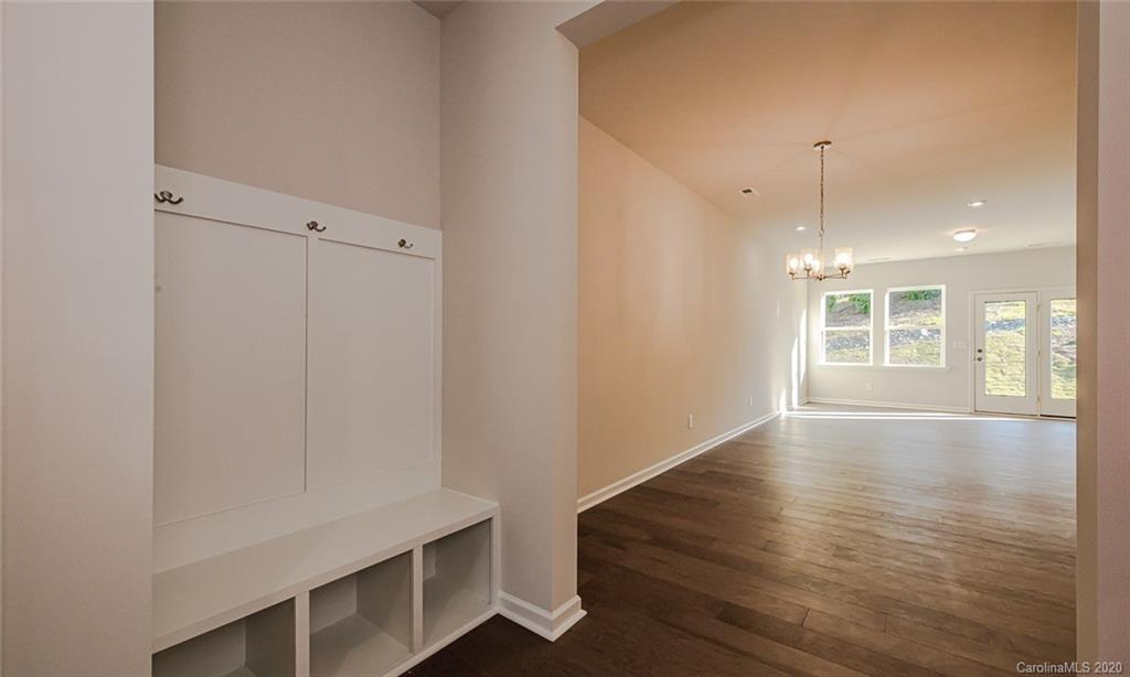 512 Madison Falls, Unit 6 Fort Mill, SC 29708 - Photo 3 of 27 a view of an empty room with wooden floor and a window