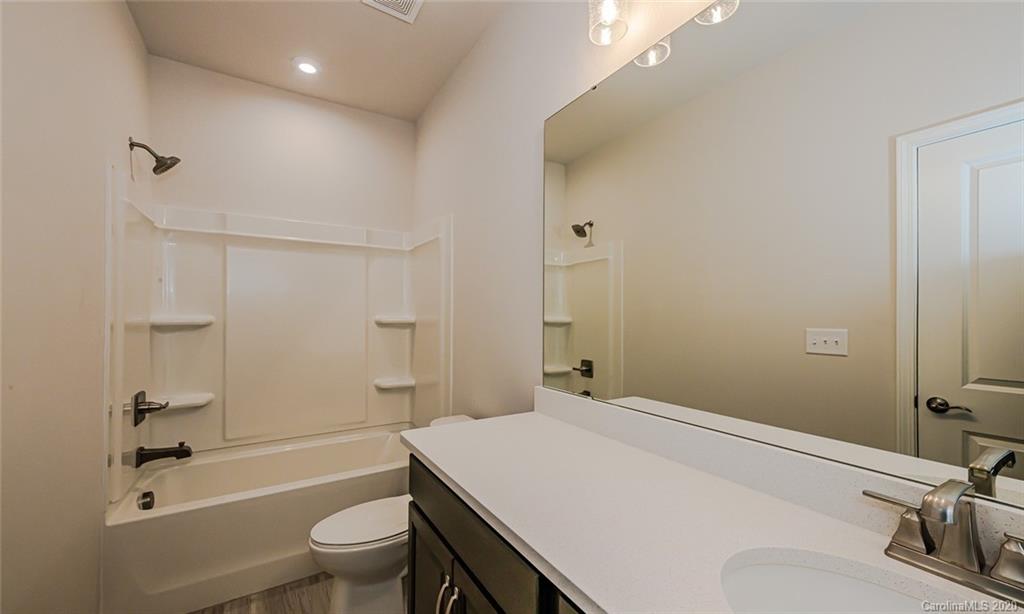 512 Madison Falls, Unit 6 Fort Mill, SC 29708 - Photo 23 of 27 a bathroom with a sink a toilet and shower
