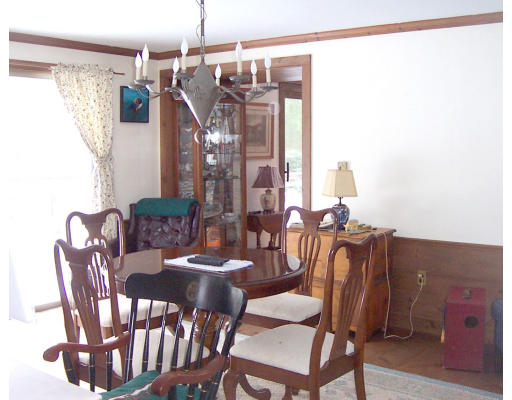 22 Herrick Road Boxford, MA 01921 - Photo 5 of 5 a view of a dining room with furniture and chandelier