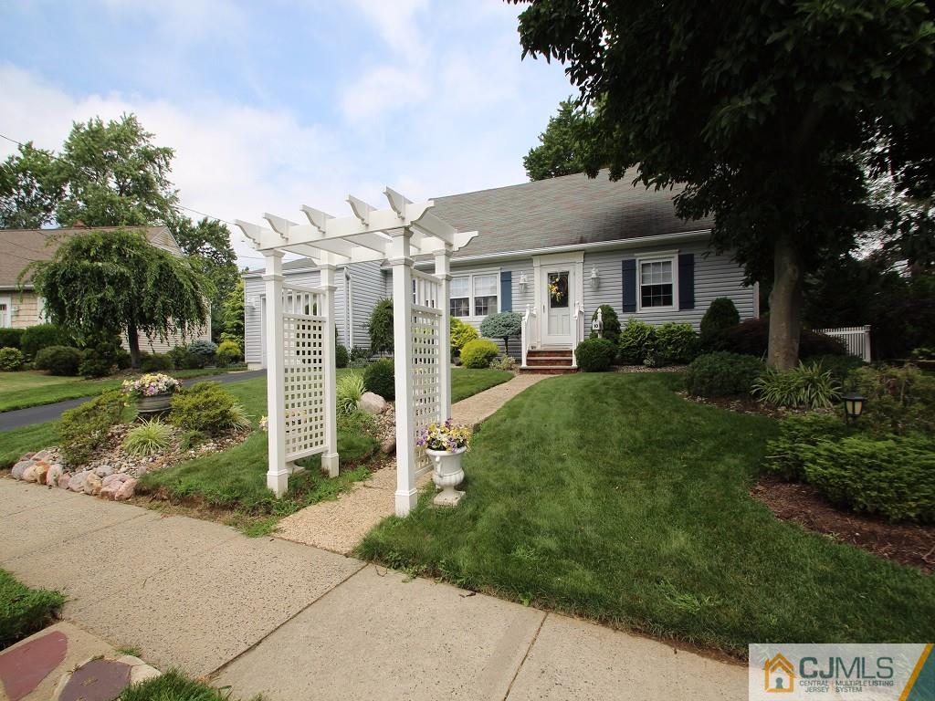10 Louise Road Edison, NJ 08817 - Photo 1 of 17 a front view of a house with a garden