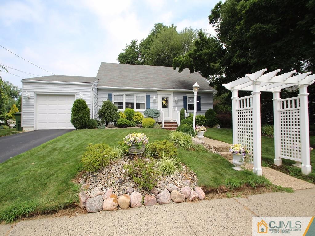 10 Louise Road Edison, NJ 08817 - Photo 2 of 17 front view of a house with a yard