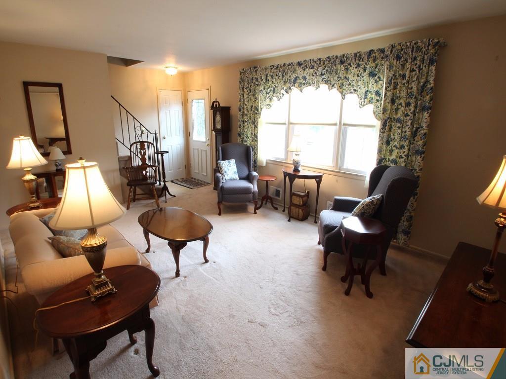 10 Louise Road Edison, NJ 08817 - Photo 4 of 17 a living room with furniture and a window