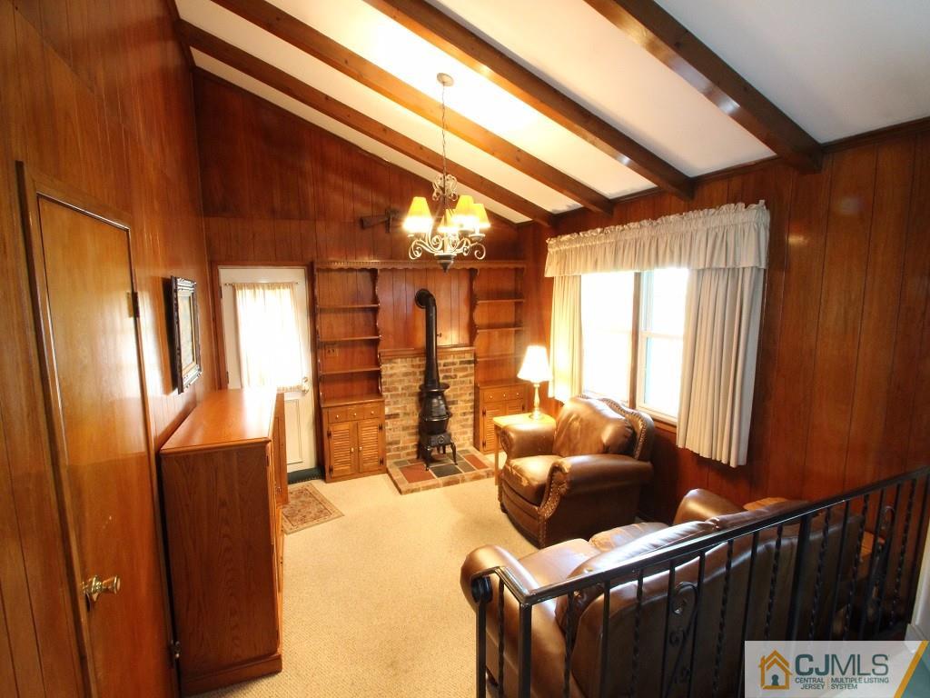 10 Louise Road Edison, NJ 08817 - Photo 7 of 17 a living room with furniture and a window