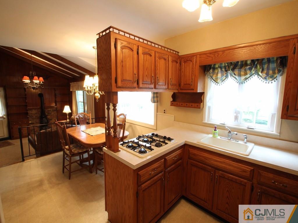 10 Louise Road Edison, NJ 08817 - Photo 8 of 17 a kitchen that has a sink and a stove in it