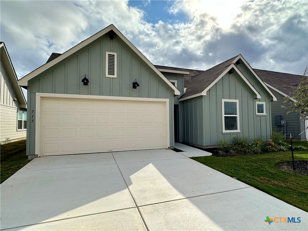 713 Signe Seguin, TX 78155 - Photo 1 of 18 a front view of house with backyard and green space