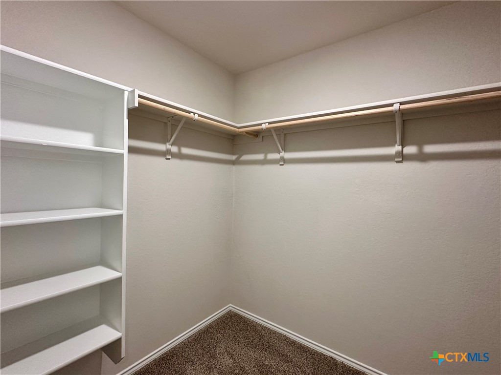 713 Signe Seguin, TX 78155 - Photo 16 of 18 a view of an empty walk in closet