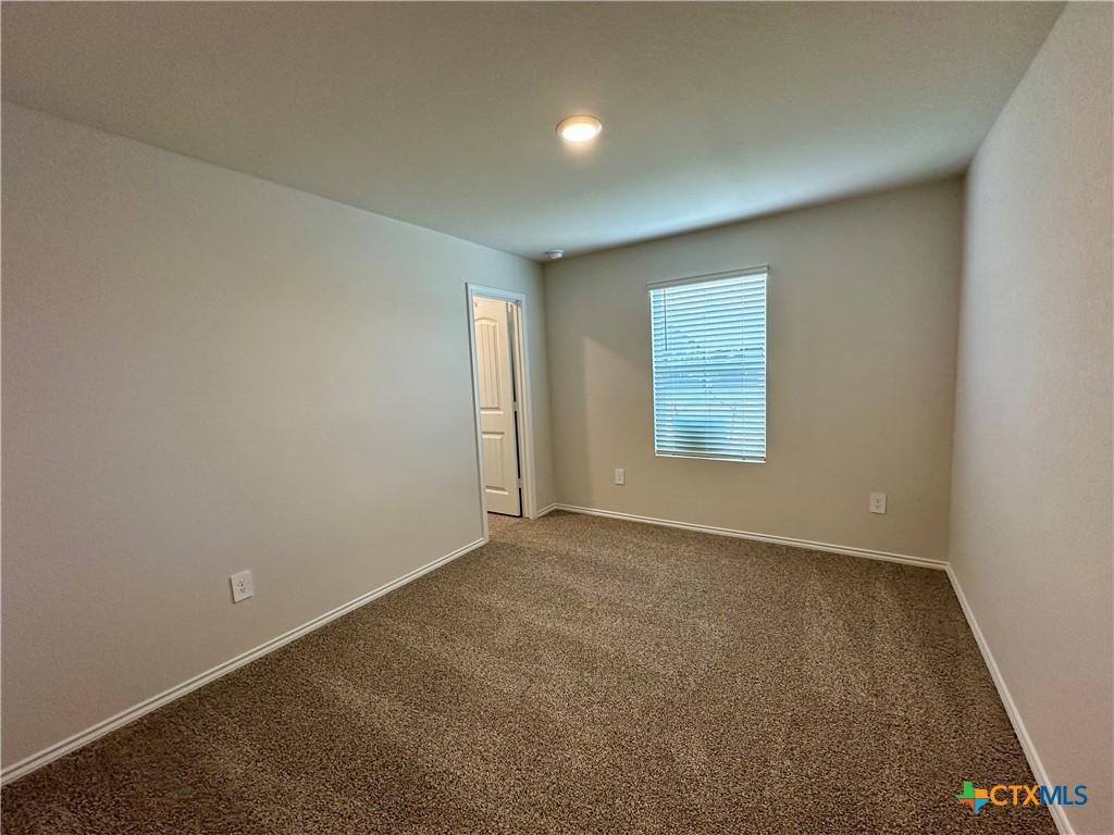 713 Signe Seguin, TX 78155 - Photo 7 of 18 an empty room with windows