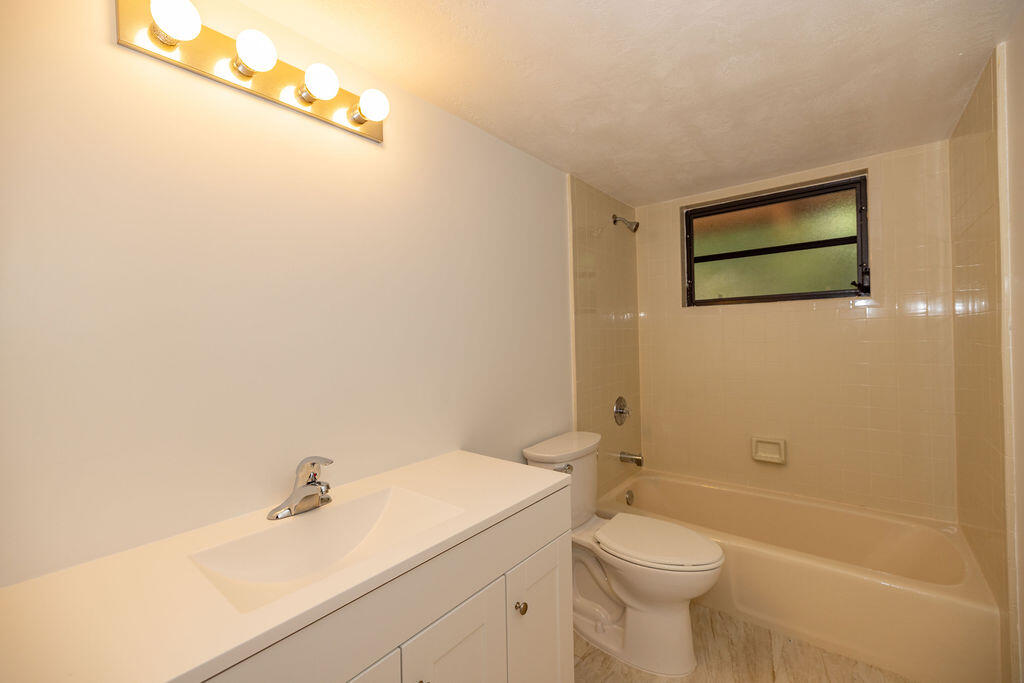 20 Park Road Islamorada, FL 33036 - Photo 16 of 37 a bathroom with a sink a toilet and shower