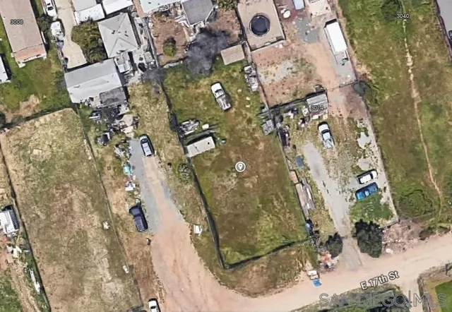 an aerial view of a residential houses with outdoor space