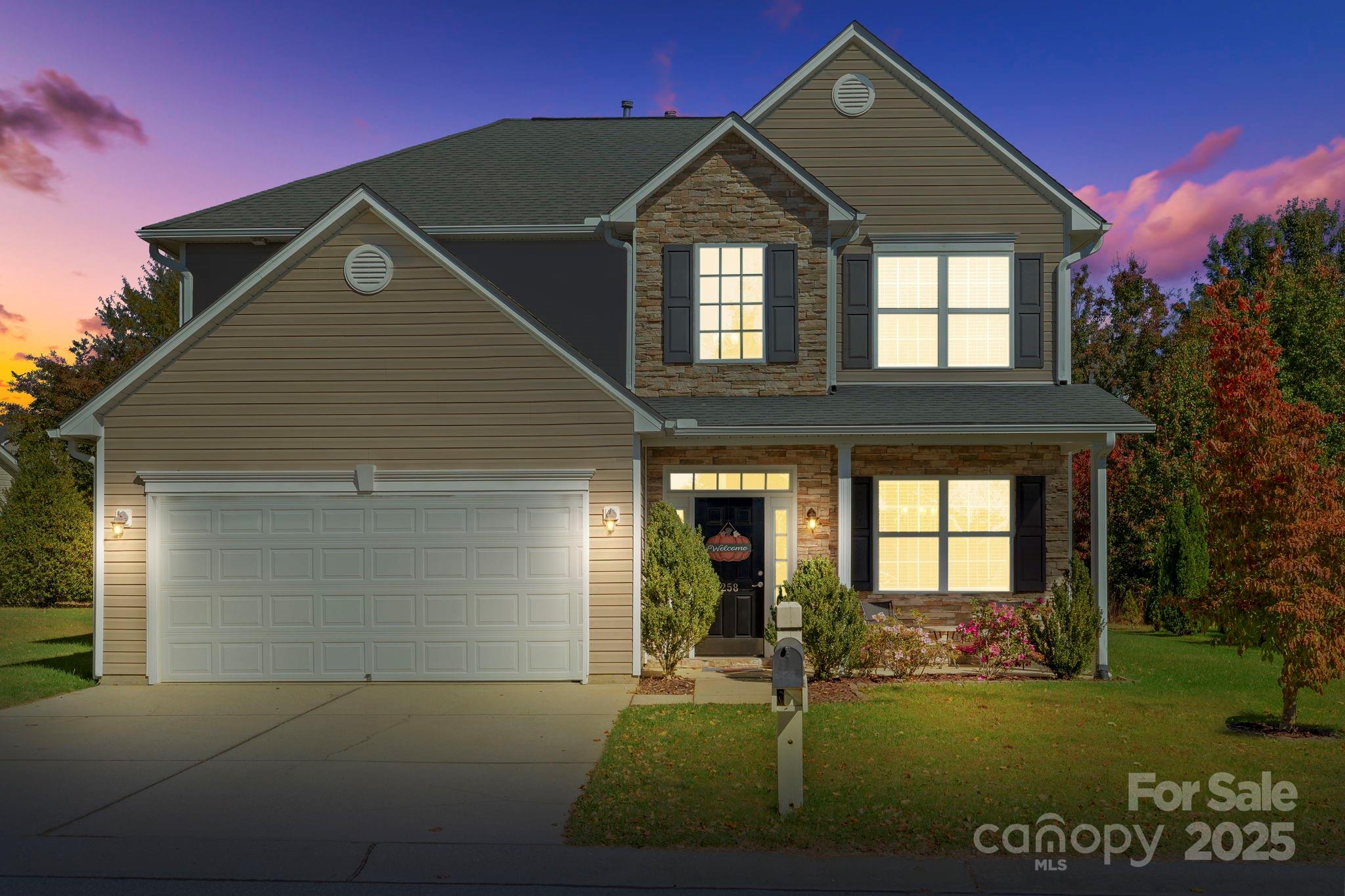 a front view of a house with a yard