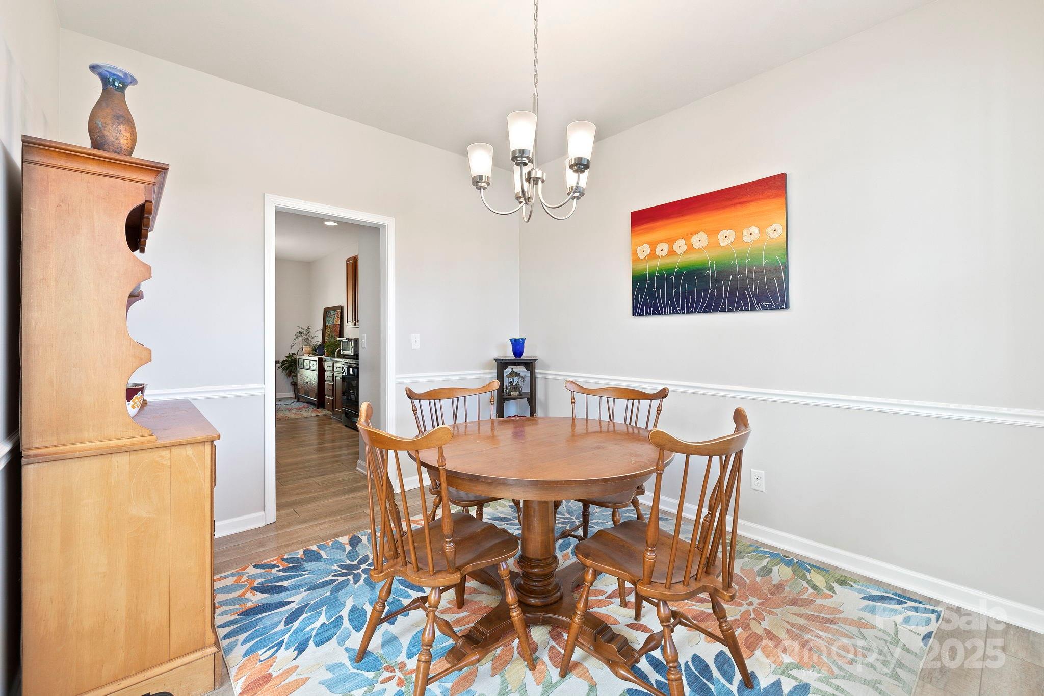 258 Lumber River Road Fletcher, NC 28732 - Photo 14 of 48 a view of a dining room with furniture and wooden floor