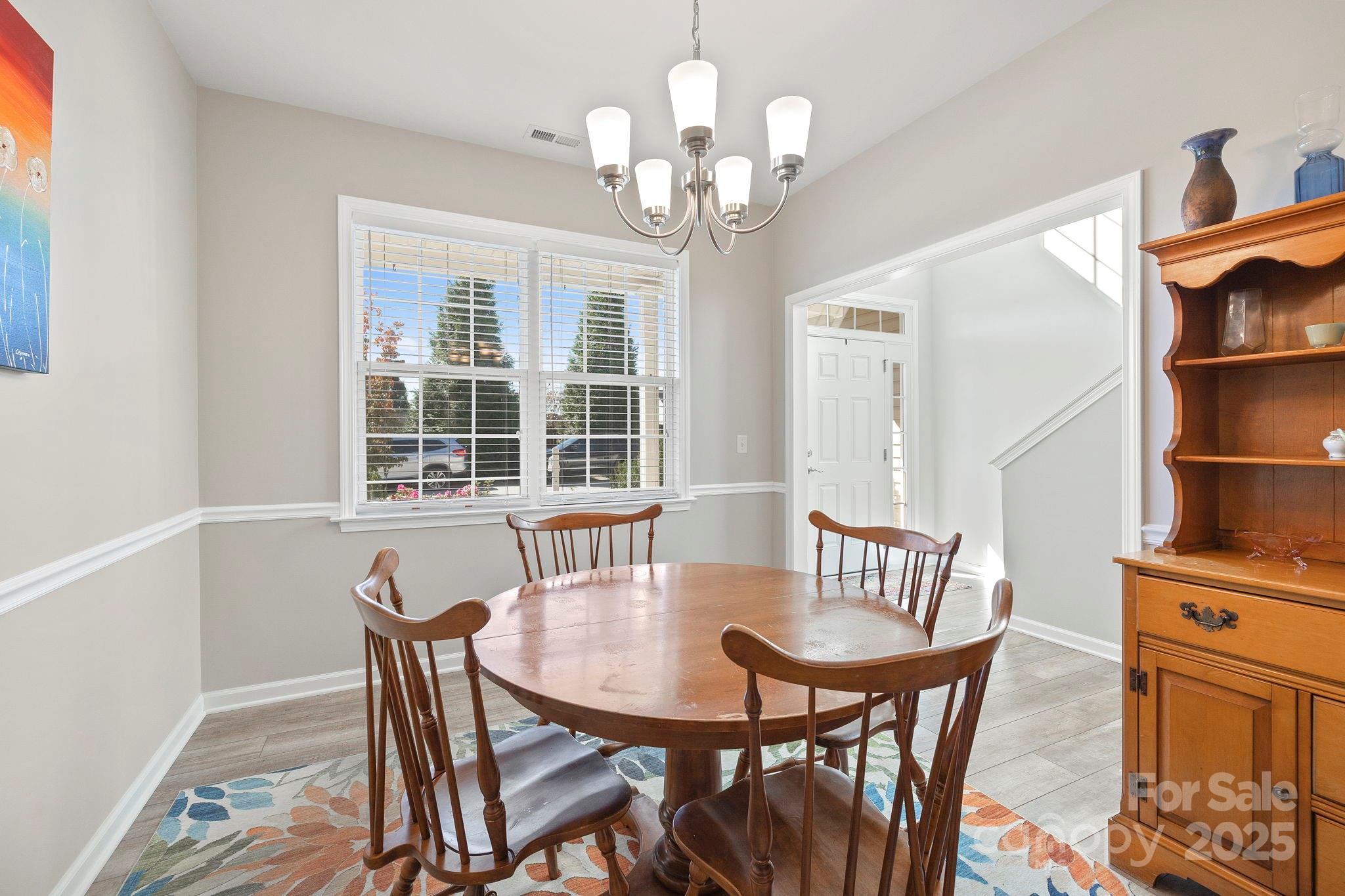 258 Lumber River Road Fletcher, NC 28732 - Photo 15 of 48 a view of a dining room with furniture and a chandelier