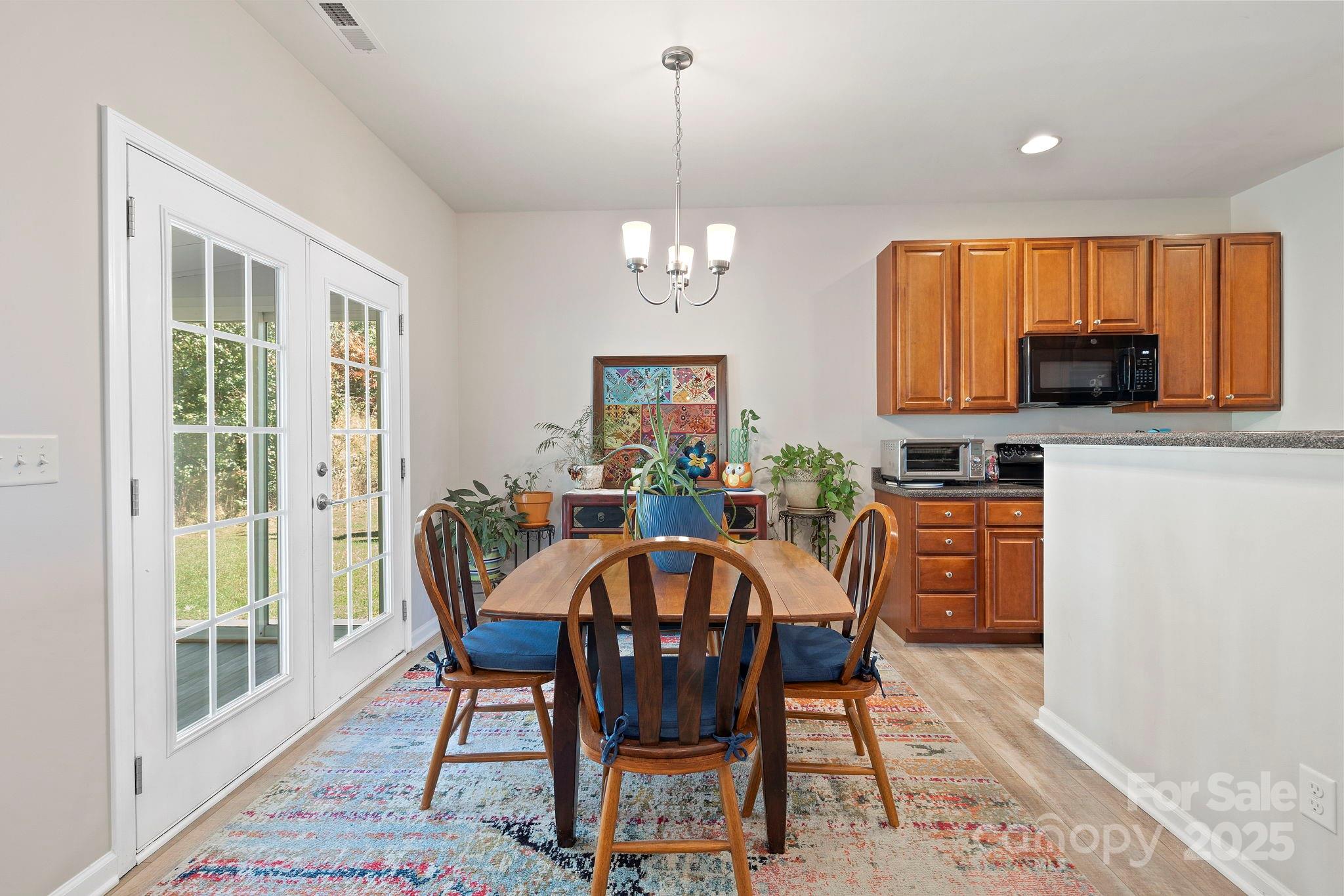 258 Lumber River Road Fletcher, NC 28732 - Photo 19 of 48 a view of a dining room with furniture window and outside view