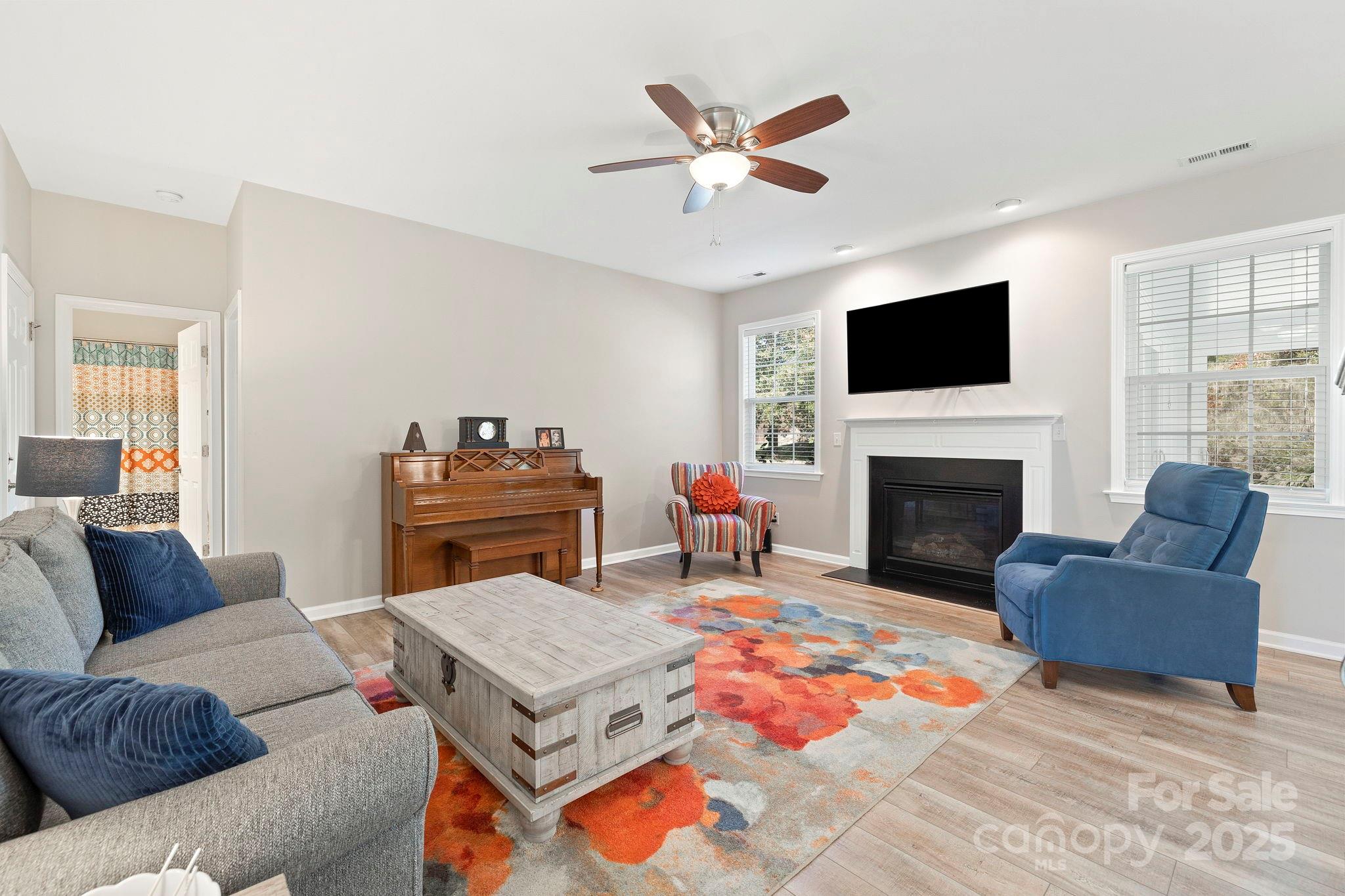 258 Lumber River Road Fletcher, NC 28732 - Photo 23 of 48 a living room with furniture a flat screen tv and a fireplace