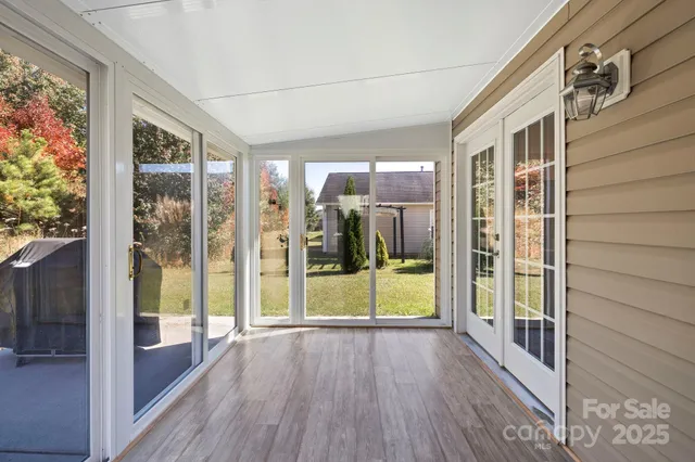 a front view of a house with a yard and outdoor seating