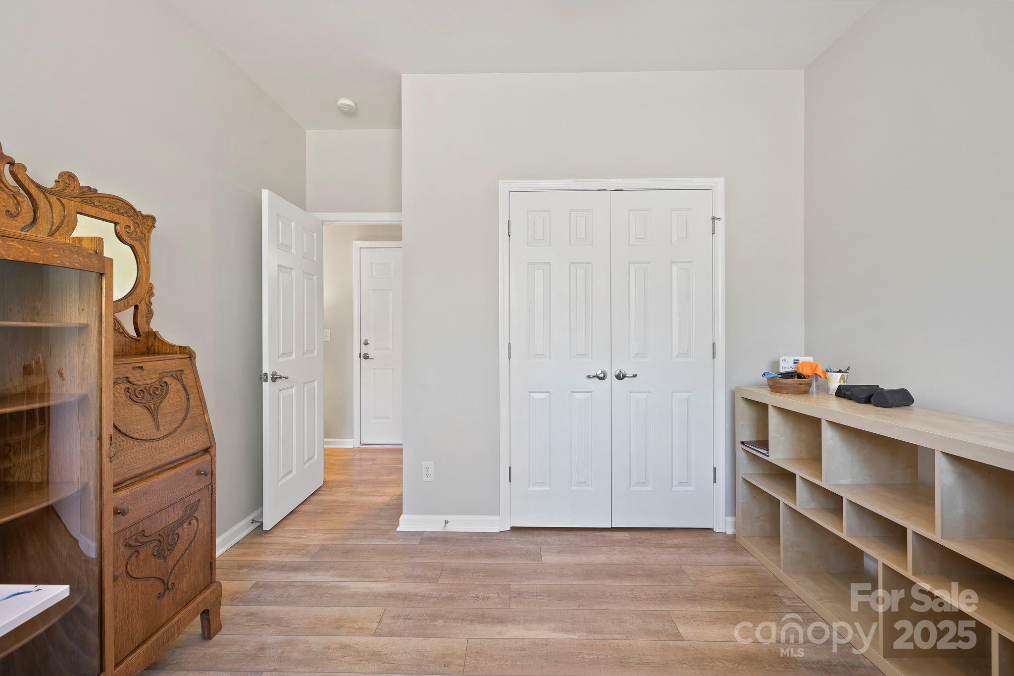 258 Lumber River Road Fletcher, NC 28732 - Photo 26 of 44 a view of a storage & utility room with closet dryer and washer