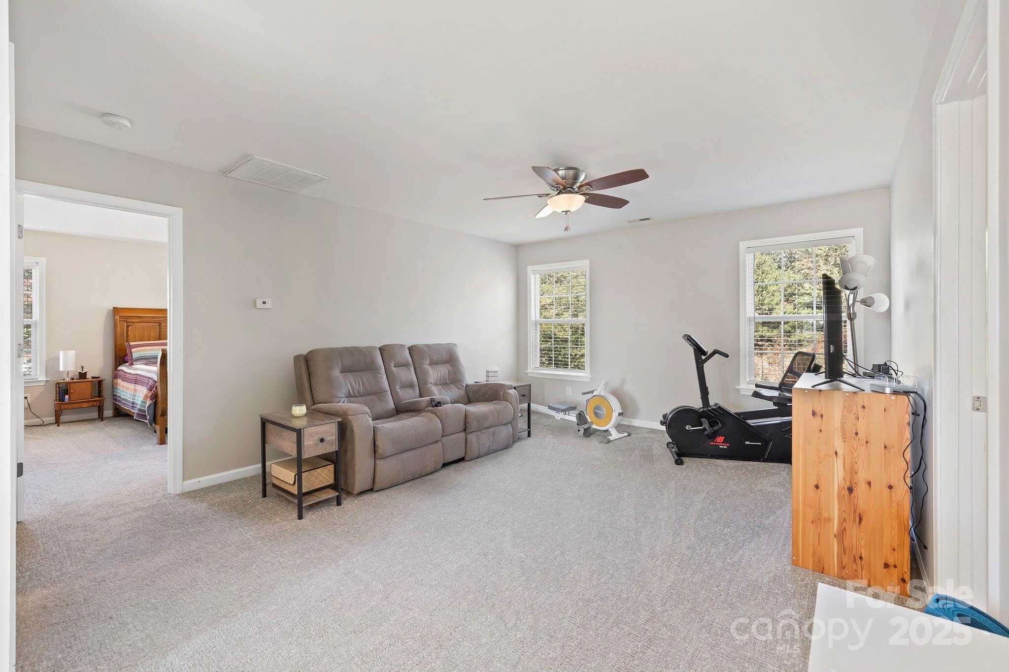 258 Lumber River Road Fletcher, NC 28732 - Photo 28 of 44 a living room with furniture and a chandelier