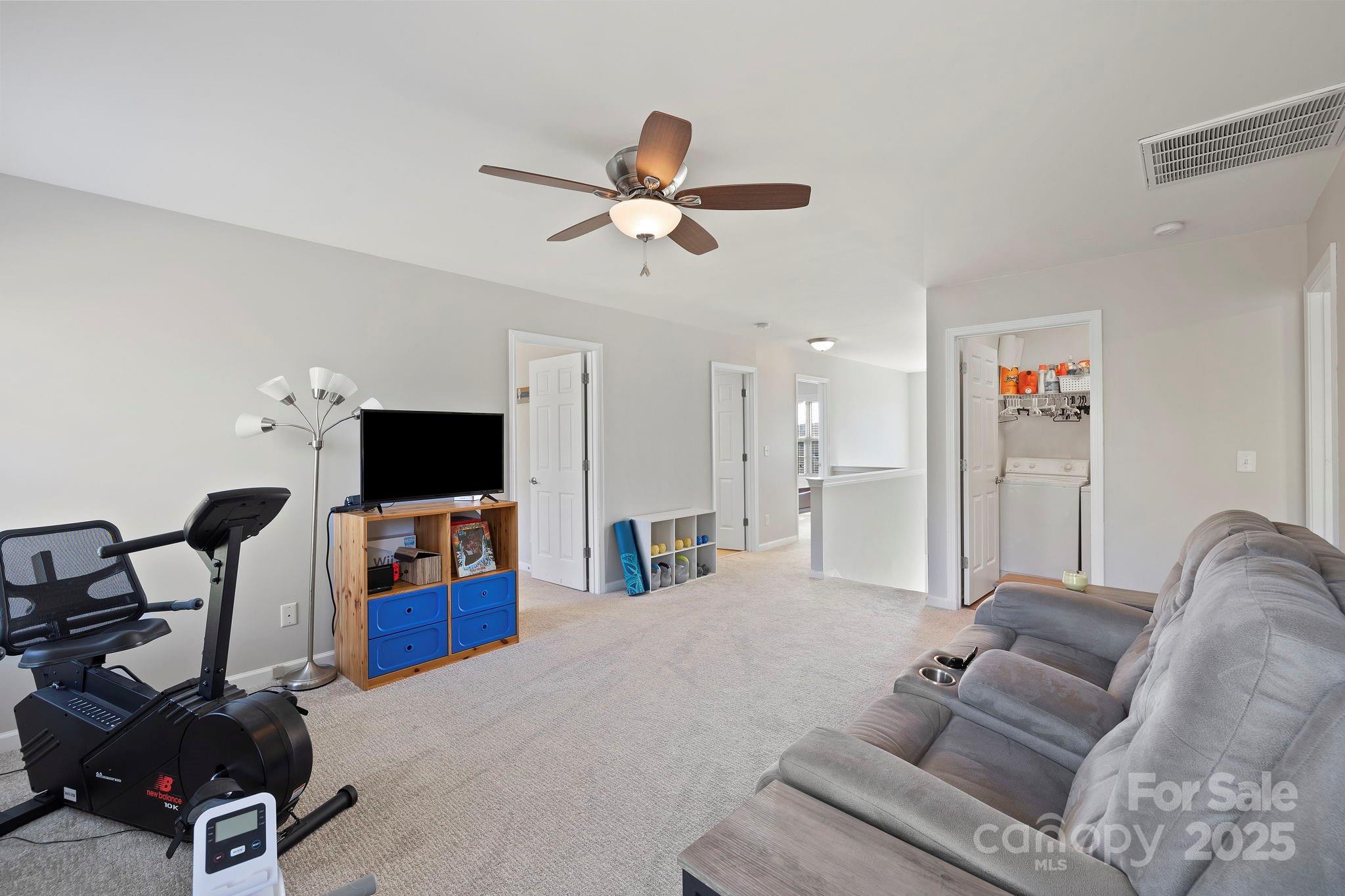 258 Lumber River Road Fletcher, NC 28732 - Photo 31 of 48 a living room with furniture and a flat screen tv