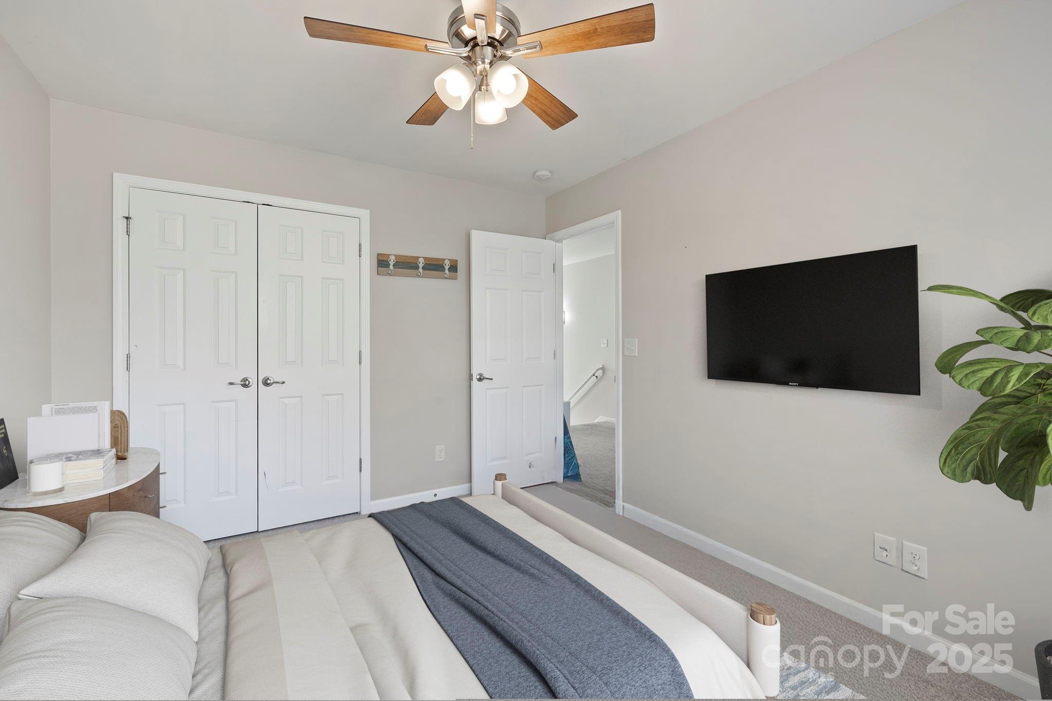 258 Lumber River Road Fletcher, NC 28732 - Photo 33 of 48 a bedroom with a bed and a flat screen tv