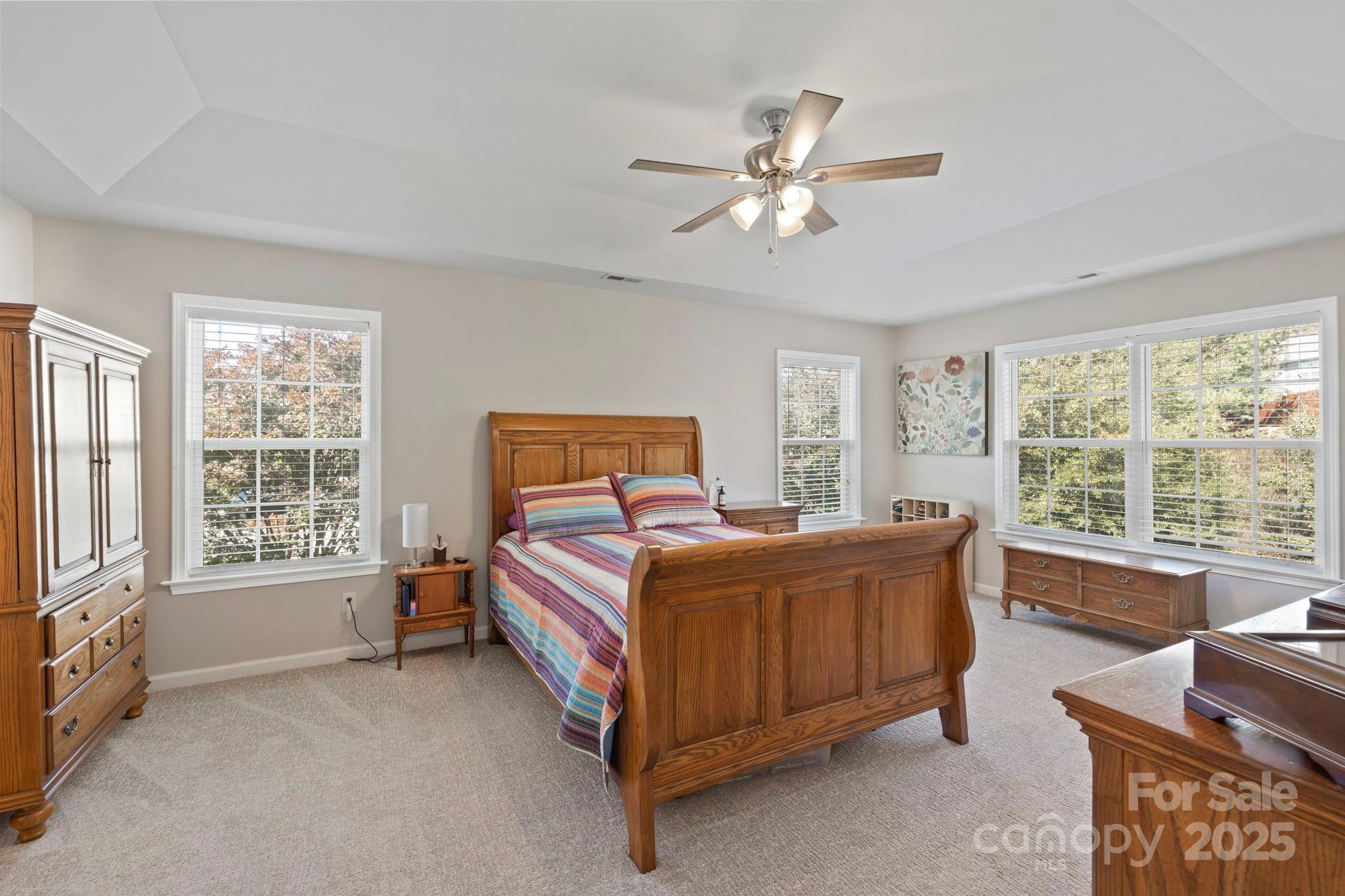 258 Lumber River Road Fletcher, NC 28732 - Photo 34 of 44 a bedroom with a bed couch and window