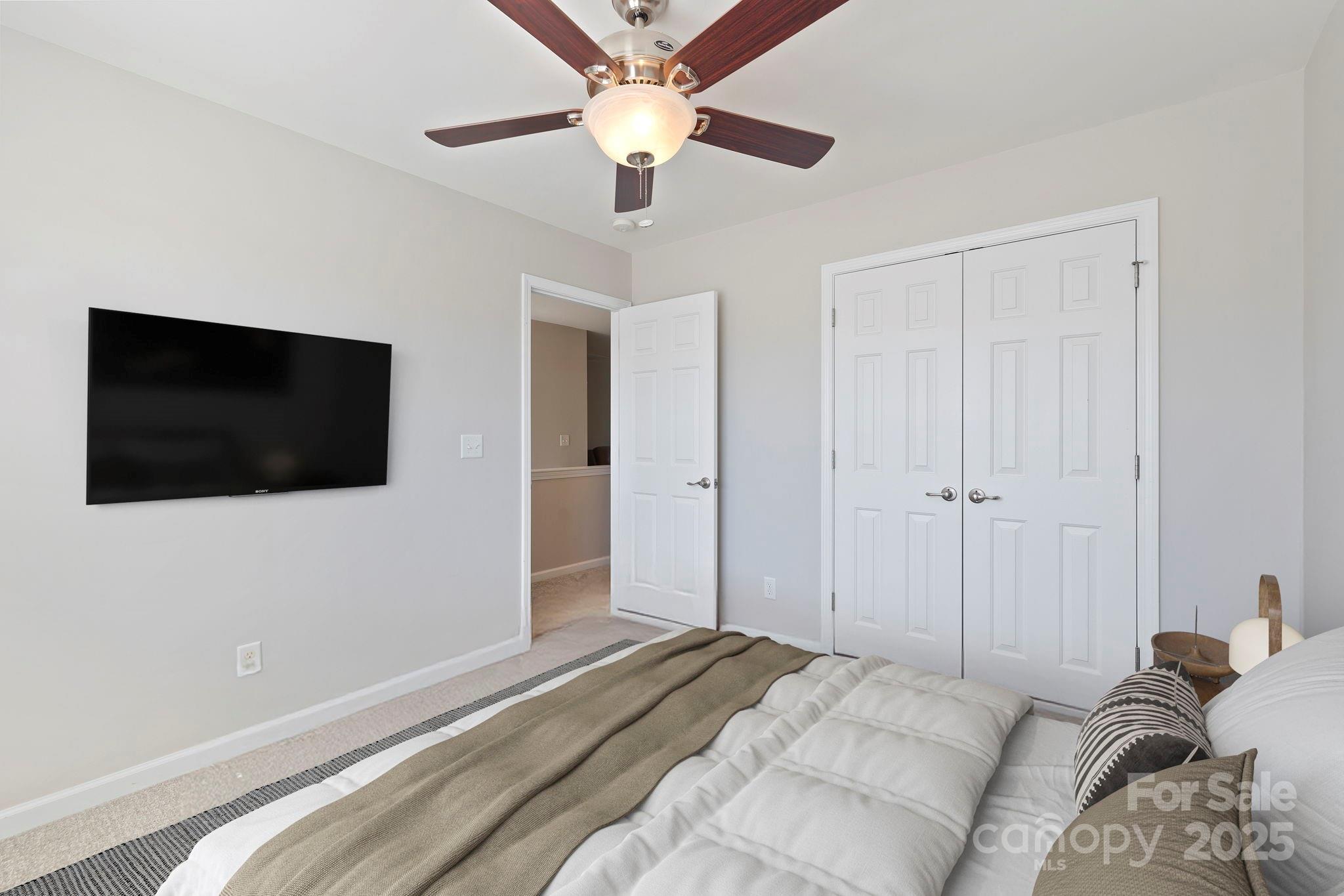 258 Lumber River Road Fletcher, NC 28732 - Photo 36 of 48 a bedroom with a bed and a flat screen tv