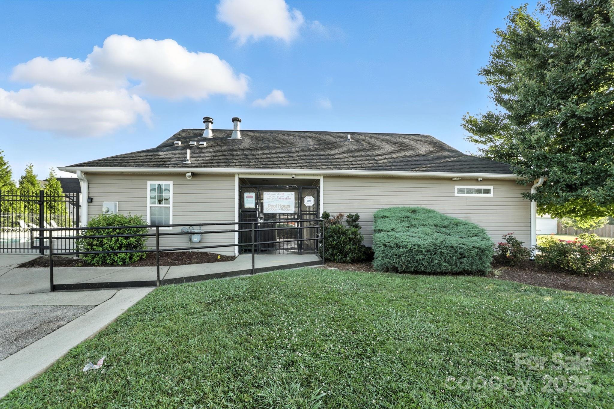 258 Lumber River Road Fletcher, NC 28732 - Photo 40 of 44 a front view of a house with a yard and outdoor seating
