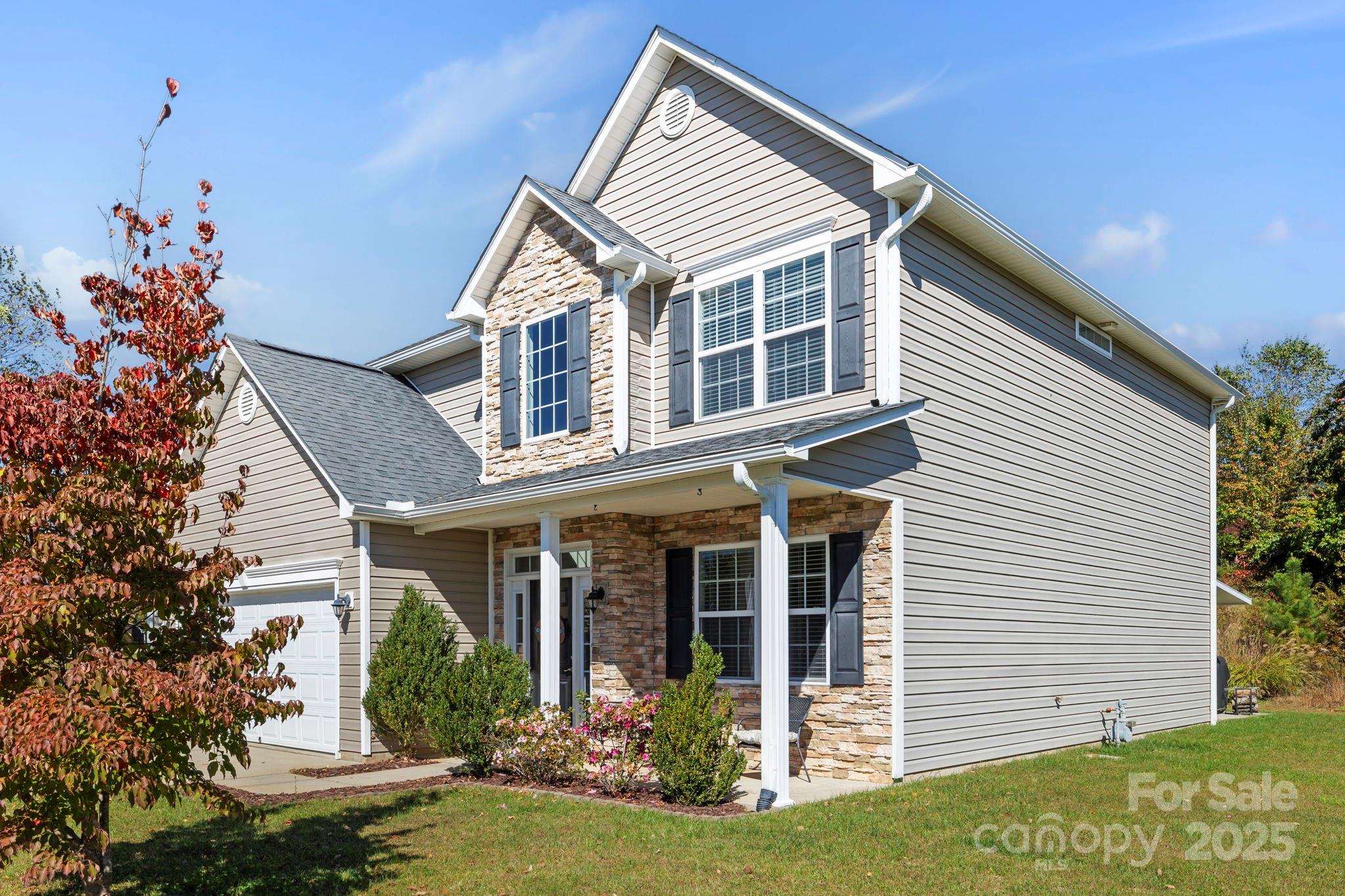 258 Lumber River Road Fletcher, NC 28732 - Photo 5 of 48 a front view of a house with garden