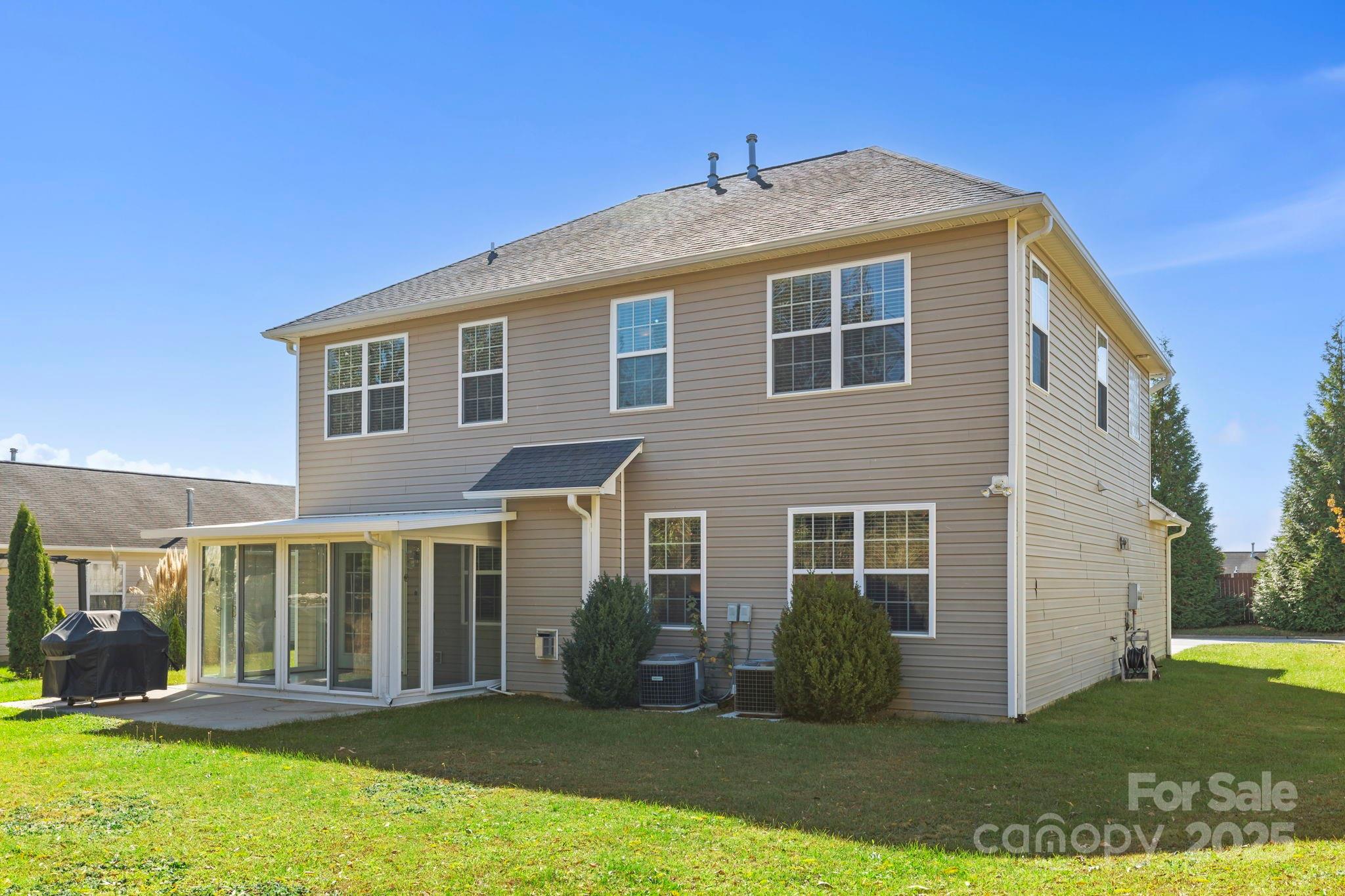 258 Lumber River Road Fletcher, NC 28732 - Photo 6 of 44 a front view of a house with a yard