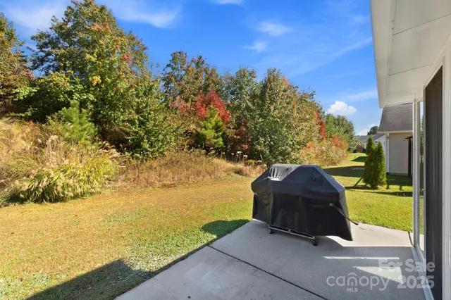 a kitchen with stainless steel appliances granite countertop a sink stove and microwave