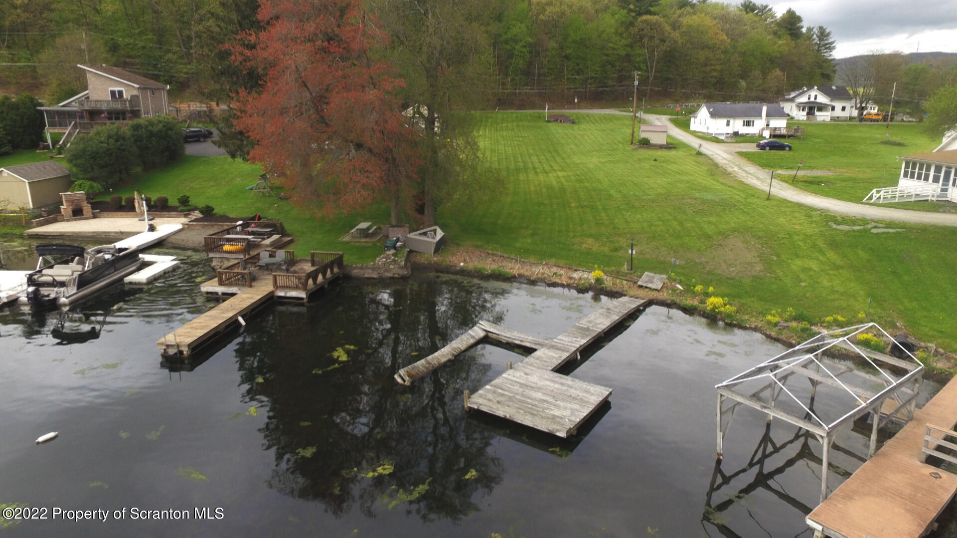 108 Frear Lane Factoryville, PA 18419 - Photo 4 of 9 an aerial view of a house with a yard basket ball court and outdoor seating