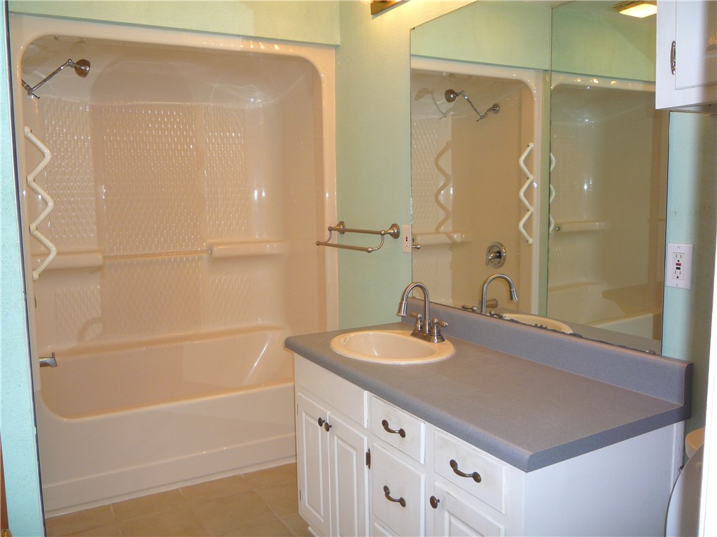 109 Lake Ridge Circle Walhalla, SC 29691 - Photo 20 of 27 A spacious vanity and built-in tub shower combination anchor this well-appointed bathroom.
